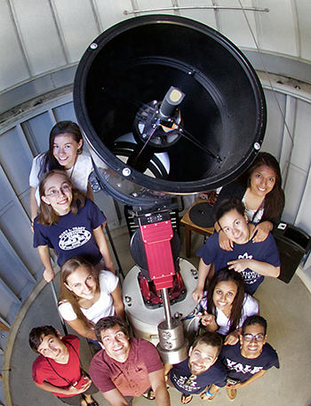 YSPA academic director Michael Faison with summer students in front of the 16-inch Ritchey-Chrétien telescope at the Leitner Family Observatory and Planetarium. (Photo by Michael Faison / Yale University)