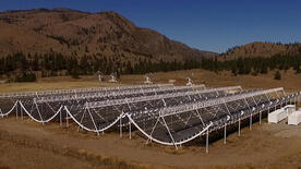 The CHIME telescope has four cylindrical reflector dishes that cover an area equal to two football fields.