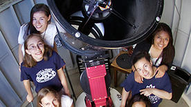 YSPA academic director Michael Faison with summer students in front of the 16-inch Ritchey-Chrétien telescope at the Leitner Family Observatory and Planetarium. (Photo by Michael Faison / Yale University)
